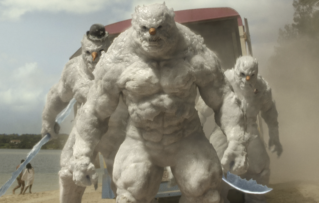 Three CGI snowmen with ultra-muscular physiques climb out of the back of a van.